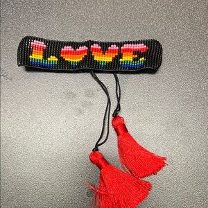 Rainbow LOVE Bracelet with Red Tassels